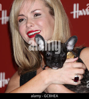 Amanda Holden holds a French Bulldog during the launch of the Harrods Winter Sale on Boxing Day, at Harrods in Knightsbridge, west London. Stock Photo