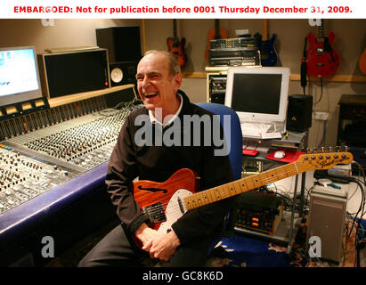 Status Quo's Francis Rossi at his home in south London after it was revealed that he and Rick Parfitt have been awarded OBEs in the New Year Honours List for their hugely successful musical career, including over 118 million record sales worldwide and a record-breaking 64 British hit singles. Stock Photo