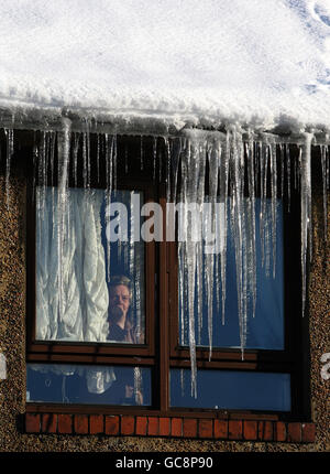 Catherine Turner looks out from a window in her house in Whitburn, West
