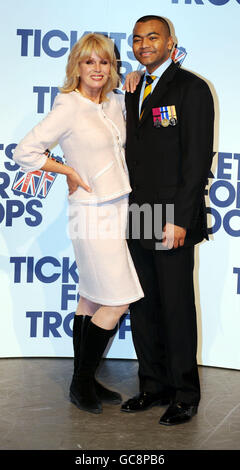 Actress Joanna Lumley with Lance Corporal Johnson Beharry VC at the Royal Opera House in London to announce a special Valentine's Day family performance of opera La Boheme, and ballet The tales of Beatrix Potter at the opera house which has donated the entire auditorium to the Tickets for Troops charity. Stock Photo