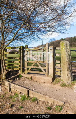 Five bar wooden gate on a public path used by walkers crossing farmland fields in Derbyshire, Peak District, England, UK Stock Photo