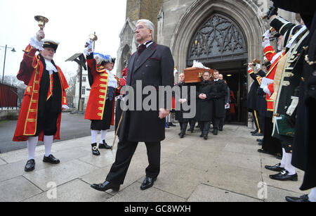 Town criers form a guard of honour to ring out at the funeral mass of colleague Peter Moore, at St George's Cathedral, Southwark. Stock Photo
