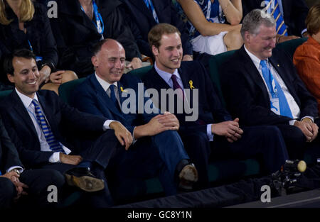 Prince William arrives on Rod Laver Arena and watches on with James Lowther-Pinkerton and Geoff Pollard during The Australian Open at Melbourne Park, Melbourne. Stock Photo