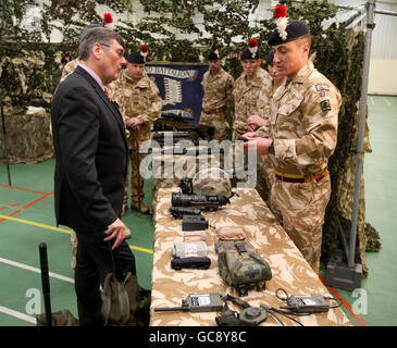 Defence Secretary Bob Ainsworth meets soldier Lance Corporal Dean Farrell, from Newcastle, (right) from the Second Fusilier guards, at their barracks in Hounslow. Stock Photo