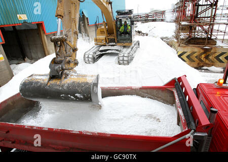 A truck is filled with salt at INEOS Enterprises Salt Business in Runcorn, Cheshire, as local councils struggle to keep roads clear of snow and ice. Stock Photo