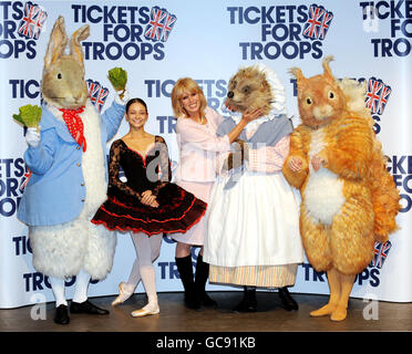 Actress Joanna Lumley accompanies Roberta Marquez, Principal with the Royal Ballet and character dancers from the tales of Beatrix Potter, (from left), Peter Rabbit, Mrs Tiggywinkle and Squirrel Nutkin at the Royal Opera House in London to announce a special Valentine's Day family performance of opera La Boheme, and ballet The tales of Beatrix Potter at the opera house which has donated the entire auditorium to the Tickets for Troops charity. Stock Photo