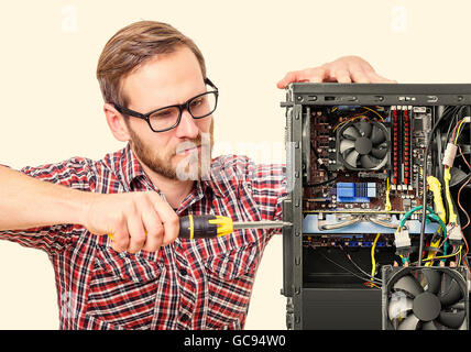 Technician repair assembles computer. Toned image. Stock Photo