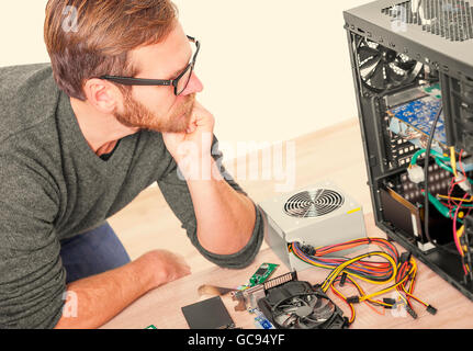 Man breaks his head on the problem of the computer. Toned image. Stock Photo