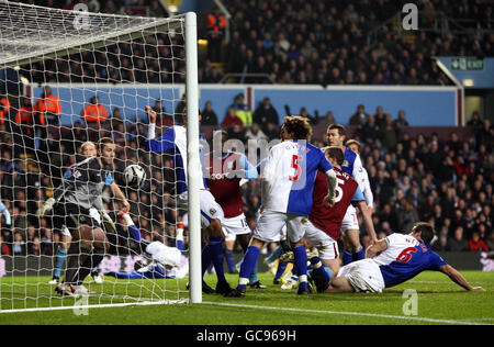 Soccer - Carling Cup - Semi Final - Second Leg - Aston Villa v Blackburn Rovers - Villa Park. Aston Villa's Richard Dunne scores their third goal during the Carling Cup Semi Final, Second Leg match at Villa Park, Birmingham. Stock Photo