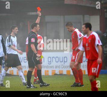 Soccer - FA Cup - Fourth Round - Accrington Stanley v Fulham - Crown Ground. Referee Stuart Attwell shows the red card to Accrington Stanley's Darran Kempson (right) Stock Photo