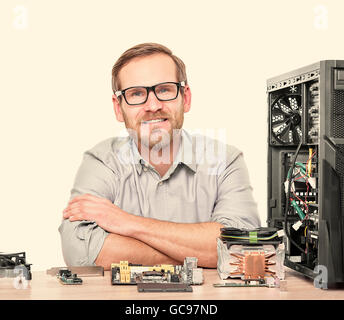 Master of computers.  Engineer assembling computers in the workplace. Stock Photo
