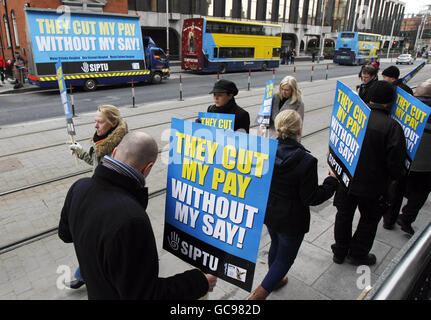 Nurses and admin staff at a Dublin['s three leading private hospitals picket the VHI health insurance headquarters in Dublin, in a row over pay and conditions. Stock Photo