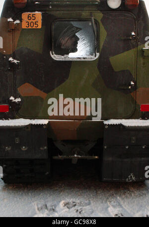 A Royal Marine from 45 Commando waits inside a BV van during a ten week winter warfare training exercise in the extreme cold conditions within the Arctic Circle at Innset, Norway. Stock Photo