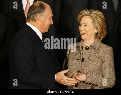 U.S. secretary of State Hillary Clinton (right) speaks with the Aga Khan (left) prior to a group photo at the Afghanistan Conference at Lancaster House in London. Stock Photo