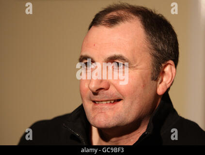 Andy Murray's father Will Murray looks at a picture of his sons Jamie ...