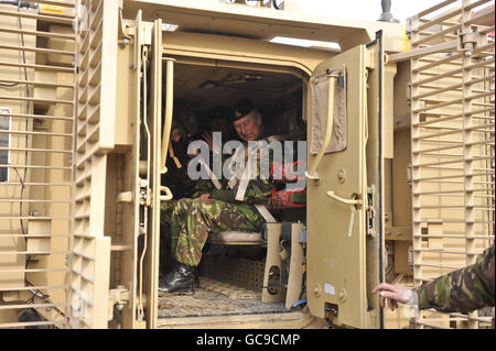 The Prince of Wales rides in the back of a Mastiff Armoured Vehicle during a visit to Salisbury Plain, Wiltshire, where, as Colonel-in-Chief, he met soldiers from the 1st Battalion, the Mercian Regiment and the Royal Dragoon Guards. Stock Photo