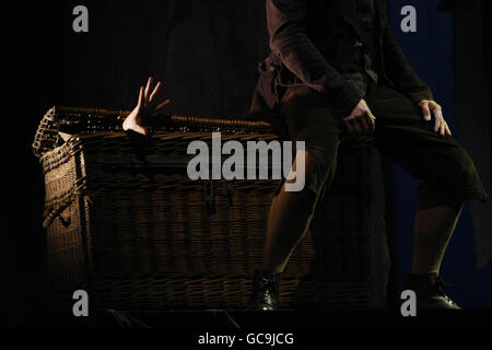 A victims hand emerges from a laundry basket during a dress rehearsal of Sweeney Todd at the Theatre at The Mill in Newtownabbey, Co Antrim. Stock Photo