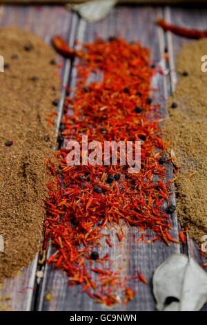 Colourful spices on the table. Various Spices in on wooden background. Spices background. saffron Stock Photo