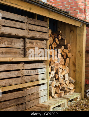 Outside log store complete with vintage fruit crates Stock Photo