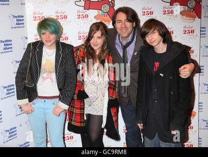 Jonathan Ross and his family (from left) Betty Kitten, Honey Kinney and Harvey Kirby arriving for toy store Hamleys 250th Birthday Party, in association with White Ribbon Alliance for Safe Motherhood, in central London. Stock Photo