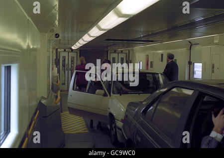 Car driving passengers leave their cars inside one of the carriages of le shuttle, on its way to calais. This 1st passenger journey through the channel tunnel was held for shareholders and the press. Roy Clementson of meopham, kent, the driver of the first lorry that went through the channel tunnel. Stock Photo