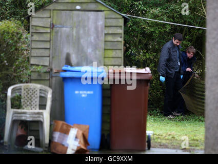 Lothian and Borders Police Scientific Support Unit (names not known) check the back garden of Susan Boyle's home in Blackburn, West Lothian. The singer returned home to find an intruder inside her house after she returned from London on Tuesday night where she had been helping to record the Helping Haiti single. Stock Photo