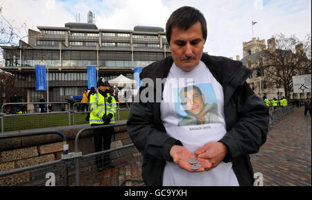 Gerald Cartwright, father of Lance Corporal James Cartwright, 21, who served with Badger 2 Royal Tank Regiment and was killed in a Warrior amoured car in Basra on 16th June 2007, with his son's dog tags outside the Queen Elizabeth II Conference Centre, Westminster London where former British Prime Minister, Tony Blair, is giving evidence to the Chilcot Inquiry. Stock Photo