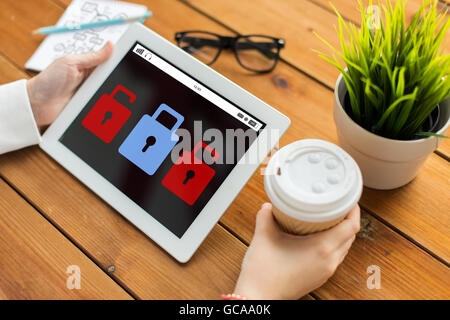 close up of woman with lock icon on tablet pc Stock Photo