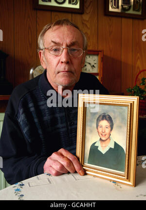 Cliff Tiltman with a picture of his daughter Claire Tiltman at home in Greenhithe, Kent, The school girl was stabbed to death in a frenzied attack in 1993. Detectives are investigating a handwritten cardboard sign left on a roadside which claims to name the killer of a grammar schoolgirl murdered 17 years ago. Stock Photo