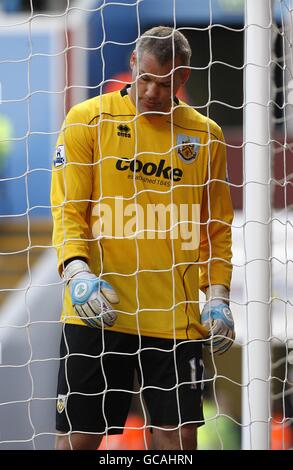 Soccer - Barclays Premier League - Aston Villa v Burnley - Villa Park. Burnley goalkeeper Brian Jensen goes to pick the ball out of the net after Burnely Concede a fifth goal Stock Photo