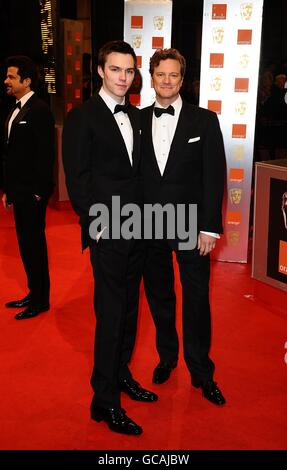 Nicholas Hoult (left) and Colin Firth arriving for the Orange British Academy Film Awards, at The Royal Opera House, London. Stock Photo