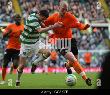 Soccer - Clydesdale Bank Premier League - Celtic v Dundee United - Celtic Park. Robbie Keane, Celtic and Garry Kenneth, Dundee United Stock Photo