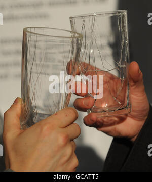 Two of the newly designed pint glasses that won't shatter on impact and are hoped to cut pub injuries when they come into use sometime next year. Stock Photo