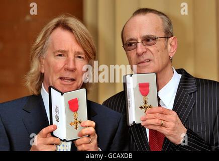 Rick Parfitt and Francis Rossi (right), founding members of British rock band Status Quo, with the OBE's that were awarded to them by Britain's Queen Elizabeth II during an investiture ceremony at Buckingham Palace in London. Stock Photo