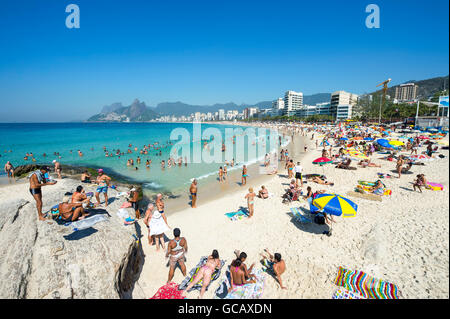 Crowded weekend morning view of Ipanema Beach from the Arpoador end in Rio de Janeiro, Brazil Stock Photo
