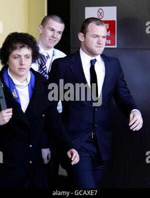 Manchester United footballer Wayne Rooney leaves Manchester Civil Court, where he gave evidence in court as he fights a 4.3 million lawsuit. Stock Photo