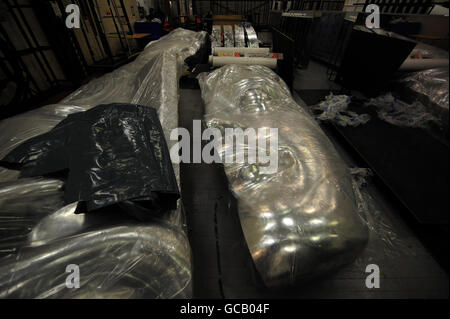 A BAFTA statue is seen wrapped in plastic as preparations are made for the BAFTA awards at the Royal Opera House, London, ahead of the awards show on Sunday evening. Stock Photo