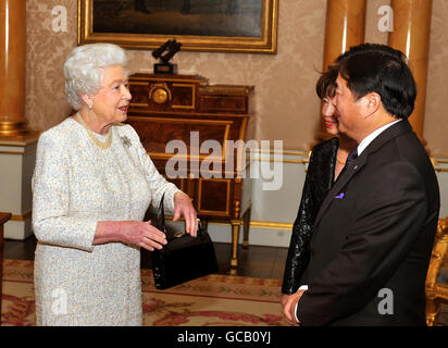 Britain's Queen Elizabeth II with Philip Lee, the new Lieutenant Governor of Manitoba, in Canada, and his wife Anita during a private meeting at Buckingham Palace in London.