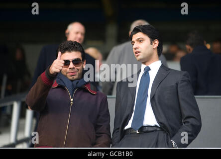 Managing Director of QPR Holdings Limited Ishan Saksena and Vice-Chairman of QPR Holdings Limited Amit Bhatia during the Coca-Cola Championship match at Loftus Road, London. Stock Photo