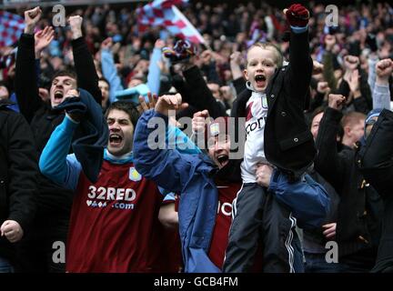 Aston Villa fans celebrate their side's first goal of the game, scored