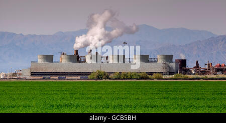 Geothermal Power Plant As Seen In The Spring, With An Alfalfa Field In Foreground And Mountains In The Background Located Near The Salton Sea In Th... Stock Photo