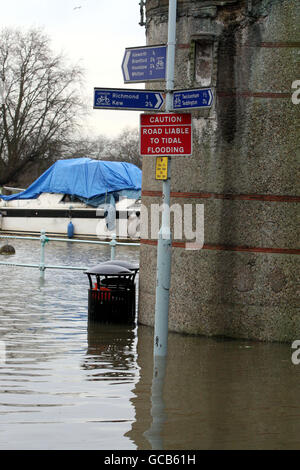 The scene in Richmond Upon Thames, Surrey after the River Thames burst it banks at high tide. Stock Photo