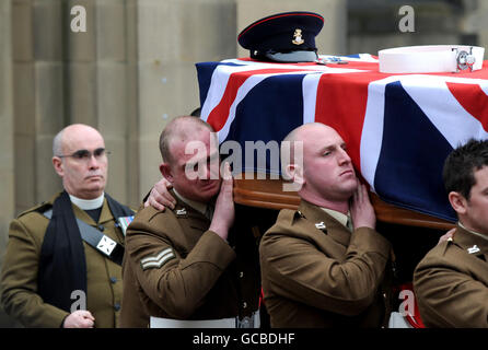 The Coffin of Corporal Liam Riley is carried from Sheffield Cathedral following his funeral service. Corporal Liam Riley, of 3rd Battalion The Yorkshire Regiment, was killed by an explosion earlier this month while serving as part of the 1 Coldstream Guards Battle Group near Malgir, in Helmand. Stock Photo