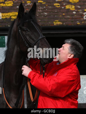 Horse Racing - Paul Nicholls Stable Visit - Manor Farm. Trainer Paul Nicholls with Big Buck's during the stable visit at Manor Farm, Ditcheat, Somerset. Stock Photo