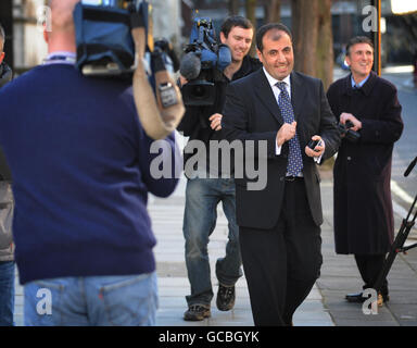 Administrator for Portsmouth FC Andrew Andronikou leaves the High Court in London where a judge ordered a hearing into whether the administration keeping the club afloat as a Premier League team was validly appointed. Stock Photo