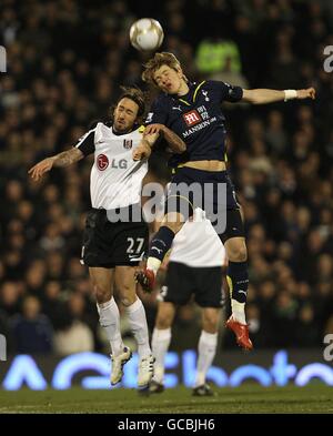 Tottenham Hotspur's Roman Pavlyuchenko (right) and Fulham's Jonathan Greening battle for the ball Stock Photo