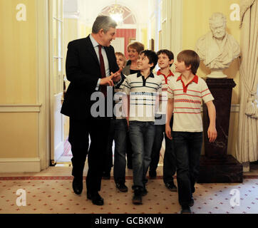 Prime Minister Gordon Brown meets four actors who all play Billy Elliot in the stage musical at 10 Downing Street in central London. Brown today launched a 600,000 scheme designed to help hard-up arts graduates break into showbusiness. Stock Photo