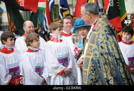 The Very Reverend John Hall (right), the Dean of Westminster Abbey accompanies Queen Elizabeth II as the Queen leaves Westminster Abbey following the annual Commonwealth Day Observance service. Stock Photo