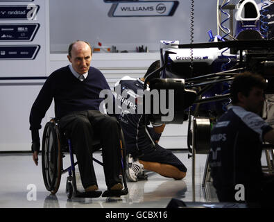 Frank Williams examines the car in the garage during the Paddock Day at the Bahrain International Circuit in Sakhir, Bahrain. Stock Photo