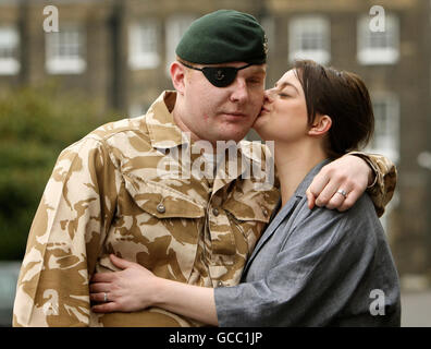 Rifleman Paul Jacobs, of The Rifles, who was awarded a George Medal in the Operational Awards List, and his fiancee Louise Smith, 24, at a ceremony at the Honourable Artillery Company, in central London. Stock Photo